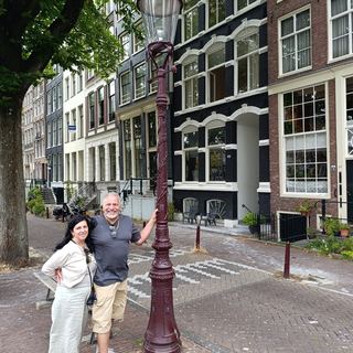 Guests walking with Dennis along an Amsterdam canal