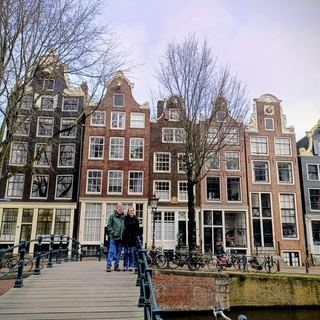 Guests with Dennis on a canal boat in Amsterdam