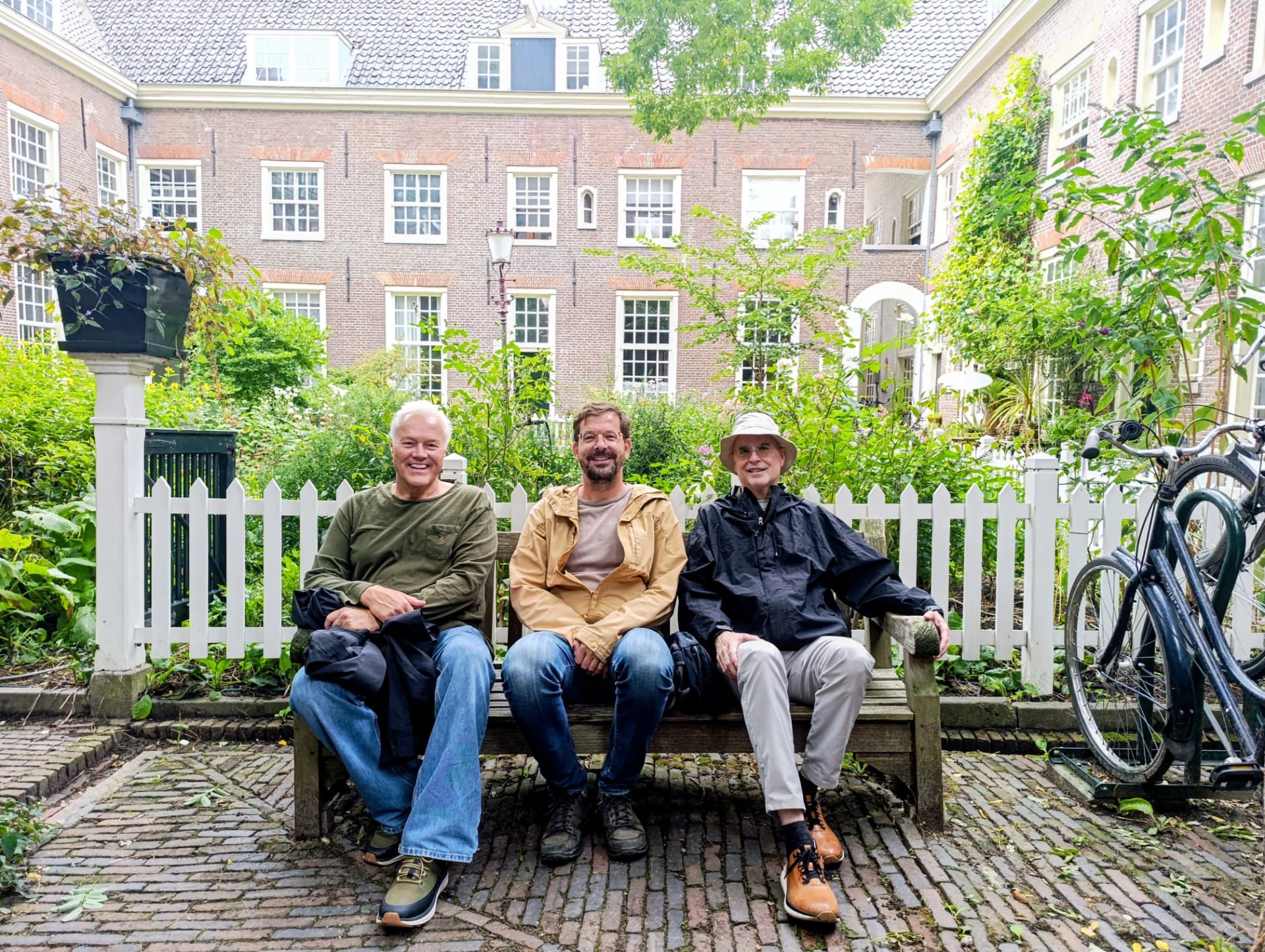 Guests with Dennis in a quiet Amsterdam courtyard
