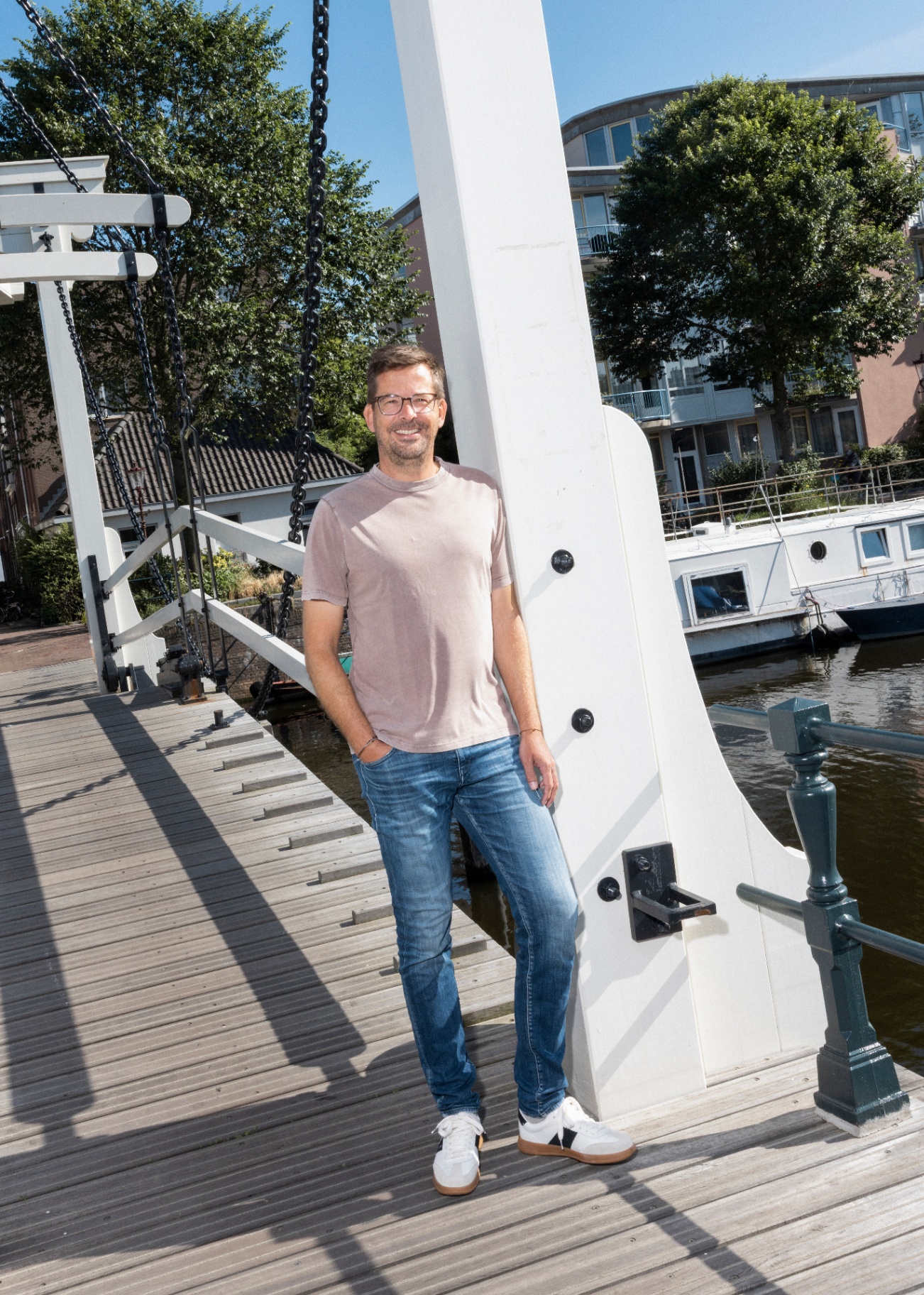Dennis smiling on a canal bridge